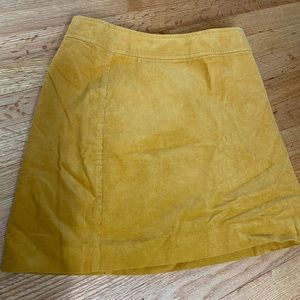 Corduroy skirt in mustard yellow zip back size 2